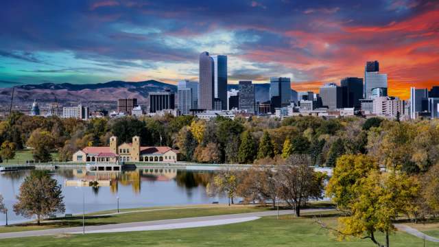 Denver, Colorado skyline across city park in autumn