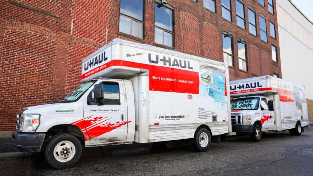 U Hauls parked on the sidewalk in Boston on moving day