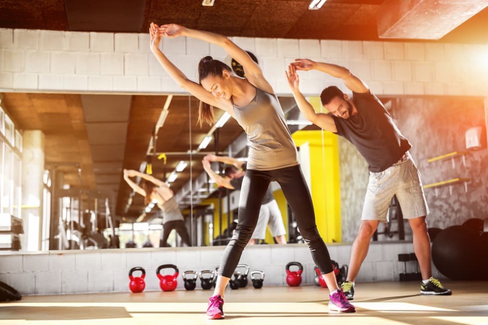 Young athletes stretching at the gym
