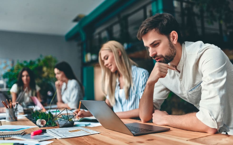 Group of young business people are working together in modern office