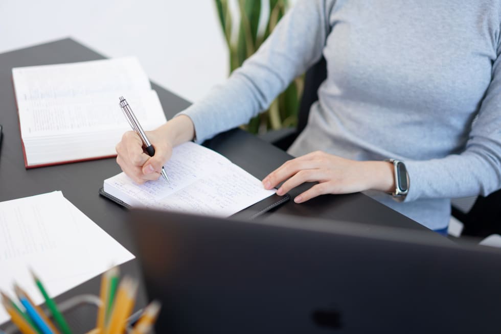 Landlord Reference Letter Template - young woman printing in an office - apartment list