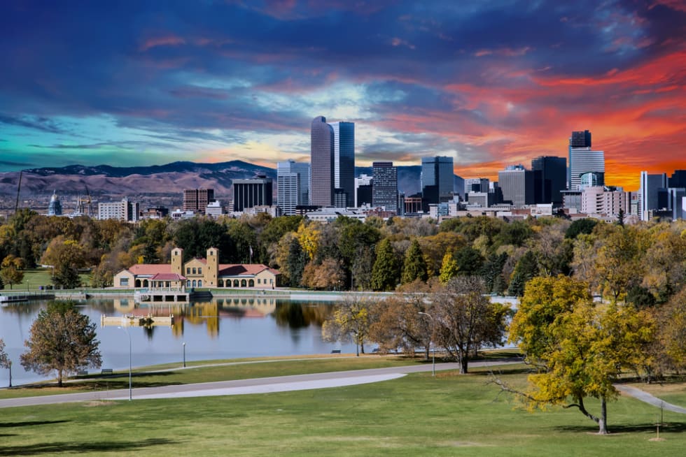Denver, Colorado skyline across city park in autumn