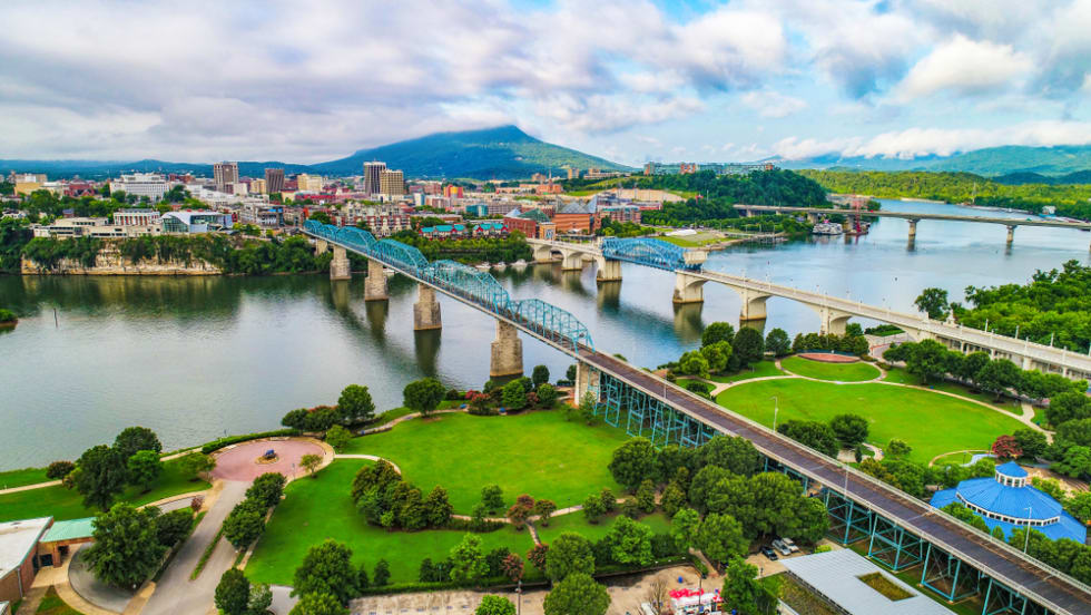  Drone Aerial of Downtown Chattanooga TN Skyline, Coolidge Park and Market Street Bridge.