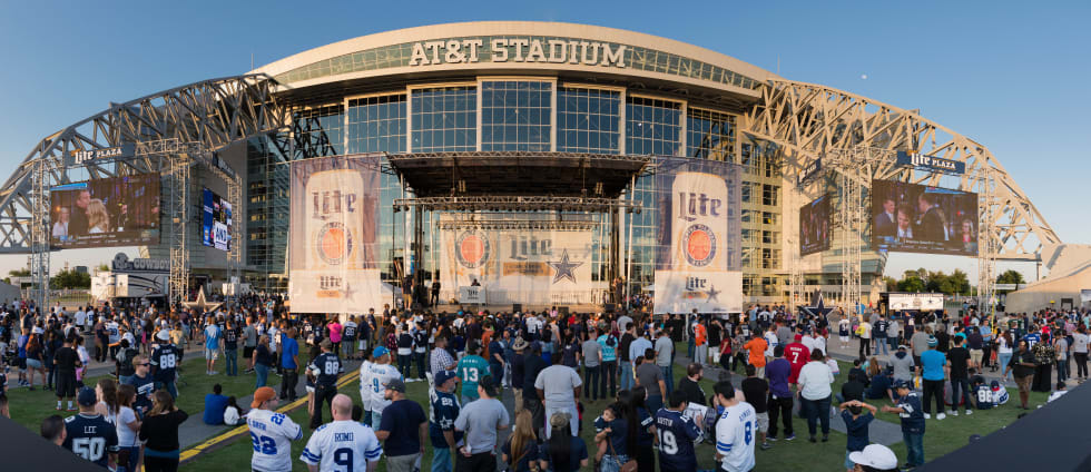 Panoramic view of the crowd outside of AT&T Stadium during the NFL draft party - cost of living in Texas