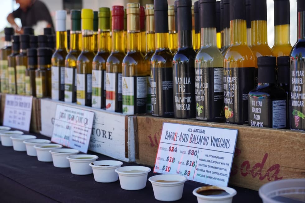 Chantilly, VA / USA - September 19, 2019: Closeup of olive oils being sold at the Chantilly Community Foodworks Farmers Market
