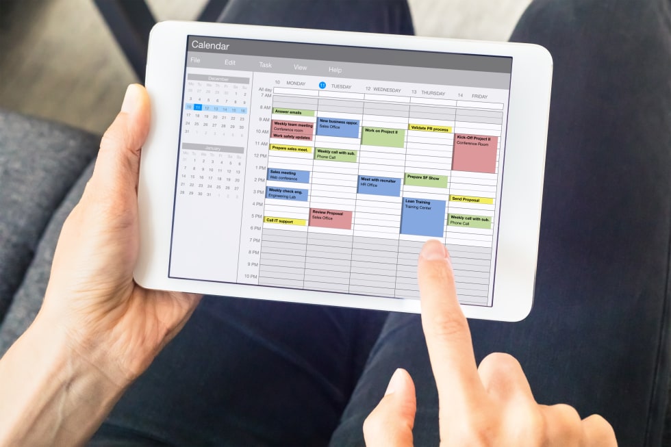 Calendar app on tablet computer with planning of the week with appointments - landlord rental inspections