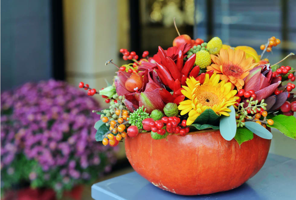 Pumpkin vase with autumn flowers