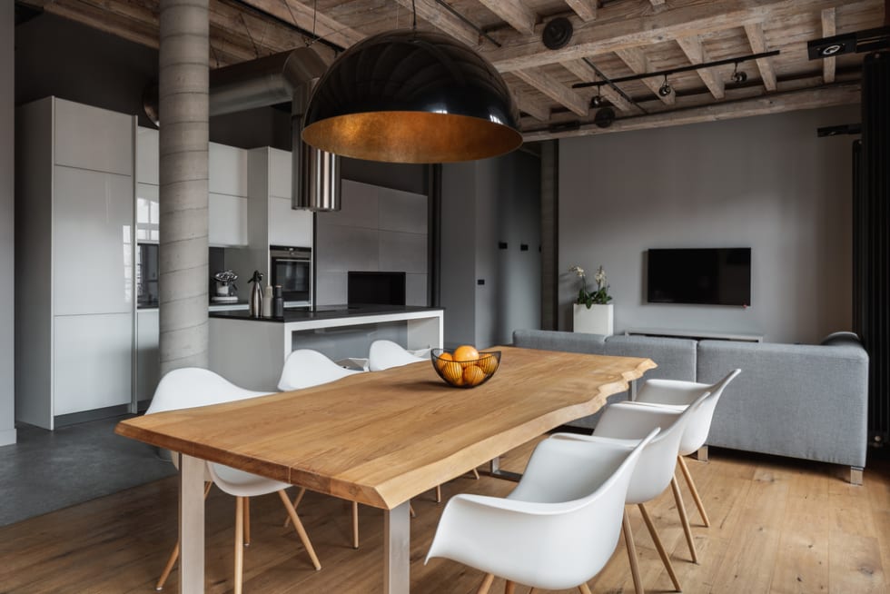  Industrial home interior with wooden ceiling and black pendant lamp