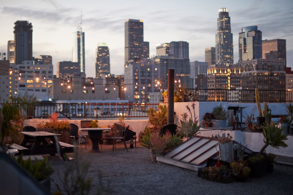  View Of Los Angeles Skyline At Sunset From Roof Terrace