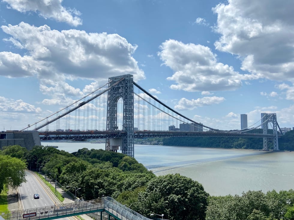 A view of the George Washington Bridge and the Hudson River from Washington Heights - best neighborhoods in new york