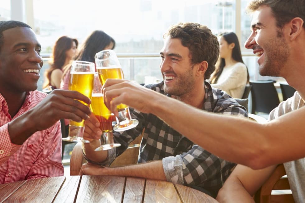 friends having beers at a bar