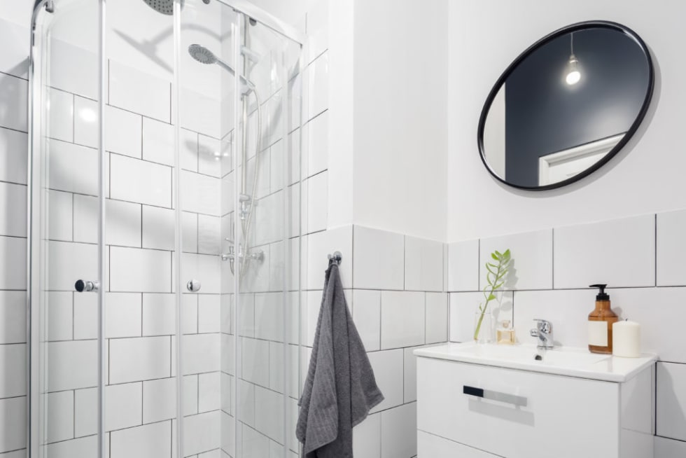 Black framed mirror in bathroom