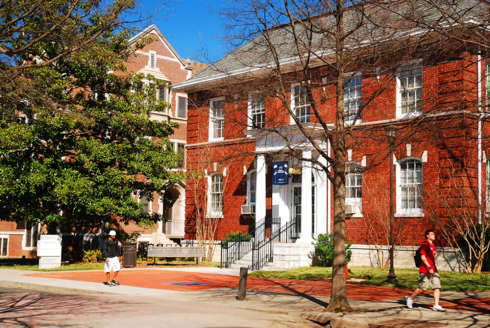 A student walks past the historic buildings on the Georgia Tech campus in Atlanta