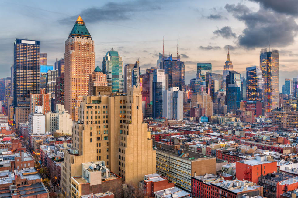  New York, New York, USA midtown Manhattan skyline over Hell's Kitchen at dawn.