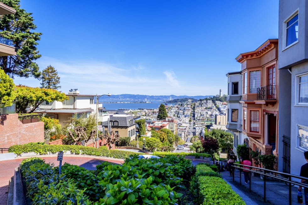  North Beach, Treasure Island, East Bay, Oakland, and Coit Tower photographed from the top of famous Lombard street in the Russian Hill and Nob Hill area of San Francisco