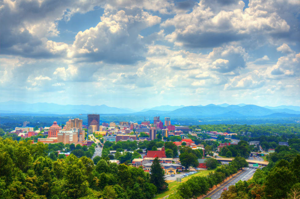  Asheville, North Carolina skyline nestled in the Blue Ridge Mountains.