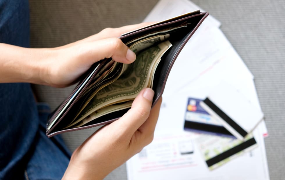 Women modern lifestyle she sat in the living room, she is open Wallet spending The bill is in her hands - cost of living in washington