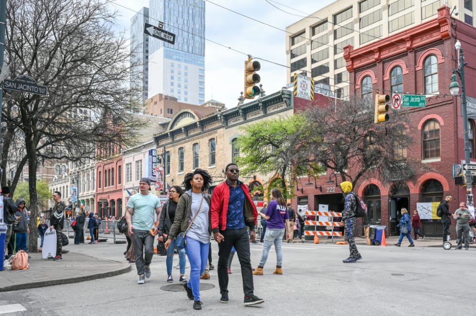 AUSTIN, TEXAS, USA - March 15, 2019: People crowd Sixth Street in Austin Texas during SXSW festival in March 2019