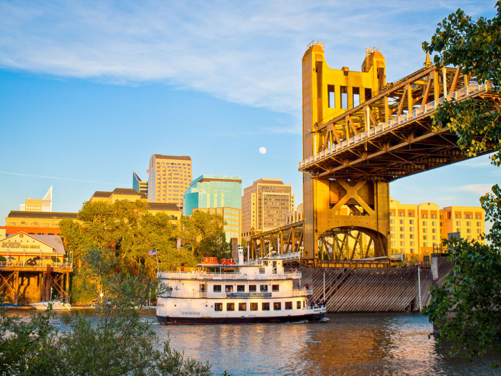  A view of Sacramento's skyline, including the vertical lift Tower Bridge and Hornblower river cruise boat