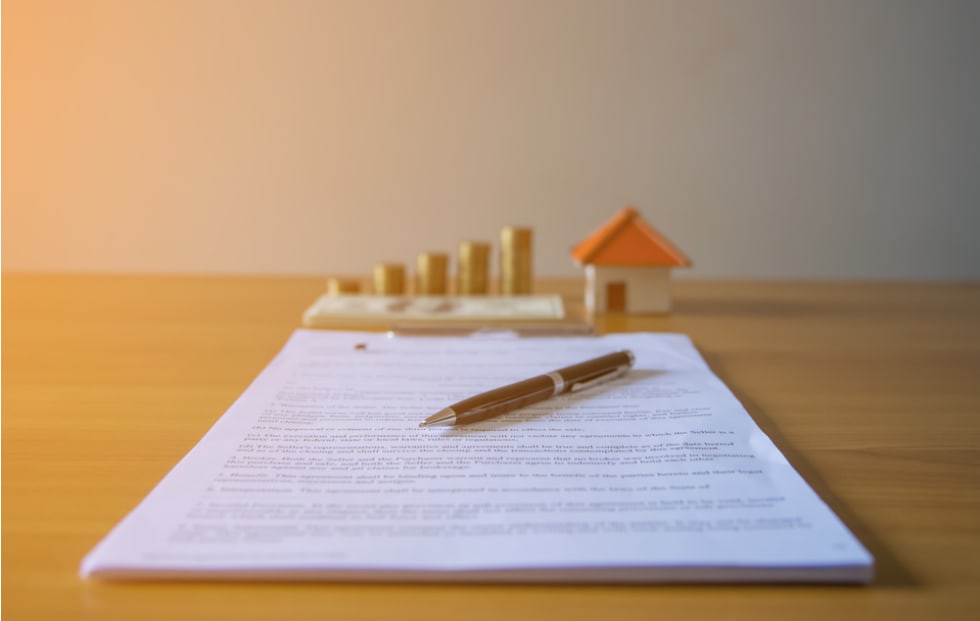 Lease / Rental agreement document with keys and pen. 