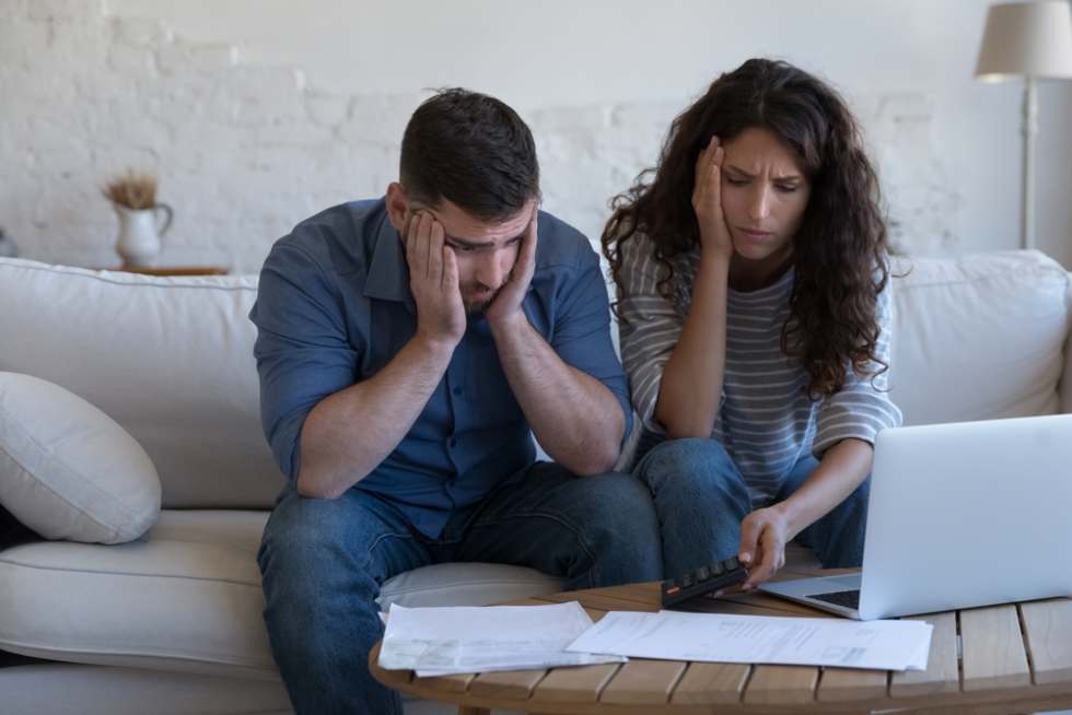 Couple finding out about hidden fees after a self-guided apartment tour