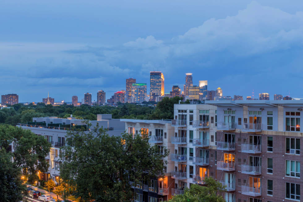  A Blue Hour Cityscape Shot of the Minneapolis Skyline over Uptown High Rise Apartments during a Summer Evening