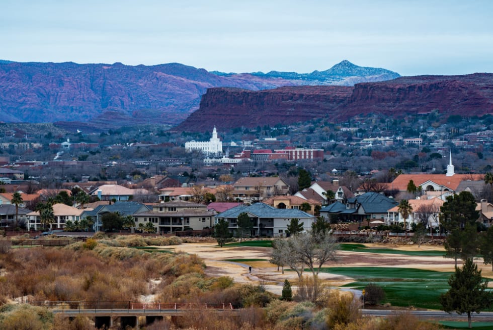 White temple and red rock mountains in St. George, Utah, USA. 