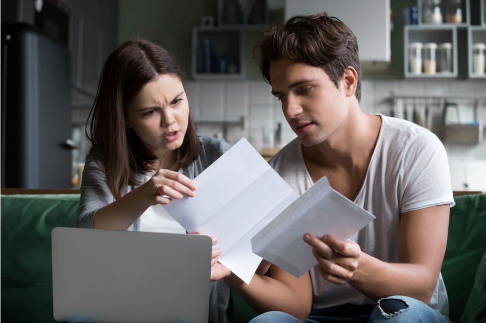 woman upset by final notice past due debt reading mail paper letter from bank - how to draft a past due rent letter.jpg