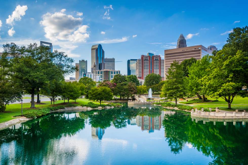 The skyline of Uptown Charlotte, and lake at Marshall Park, in Uptown Charlotte, North Carolina.