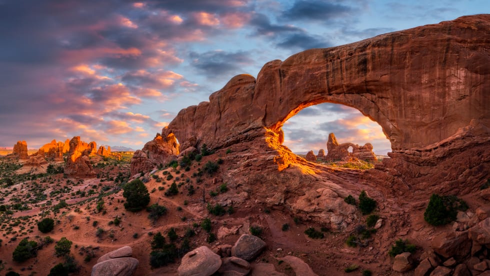 Evening light over North Window with Turret Arch in the distance, Arches National Park Utah - cost of living in Utah