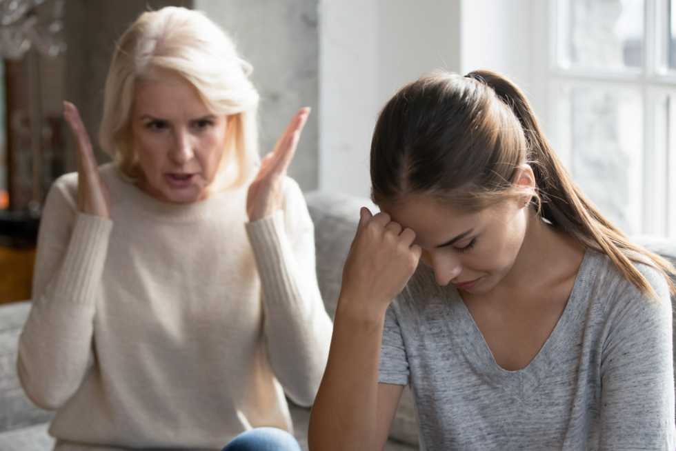 Young adult arguing with mother