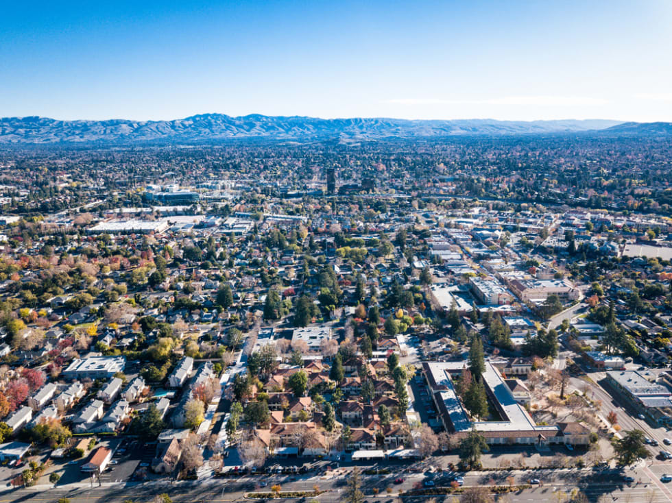 Birds eye view photo of Silicon Valley in California with San Jose downtown on the background