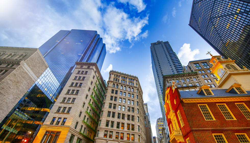 Sunset view of Boston buildings from city street, Massachusetts