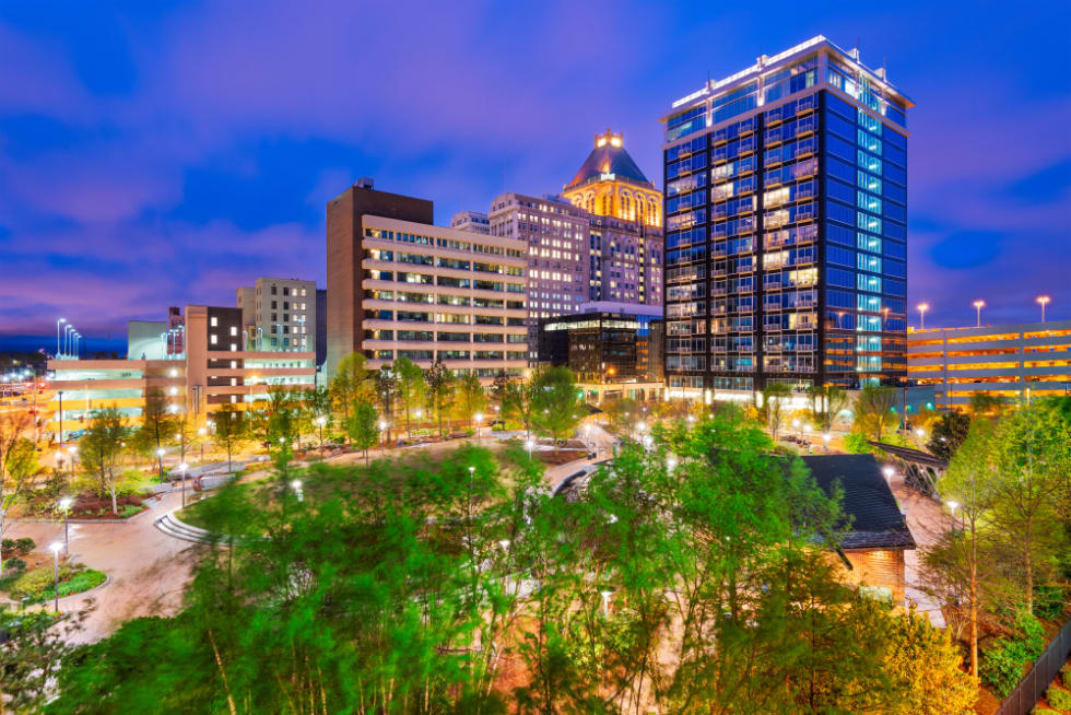  Greensboro, North Carolina, USA downtown city skyline at night.