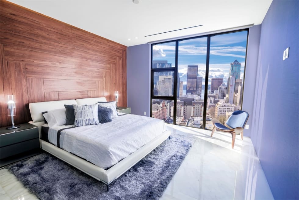 Modern and contemporary bedroom in Seattle with views of the financial district of the city.