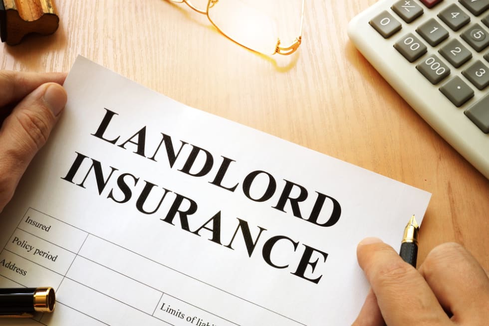  Landlord insurance on a desk.