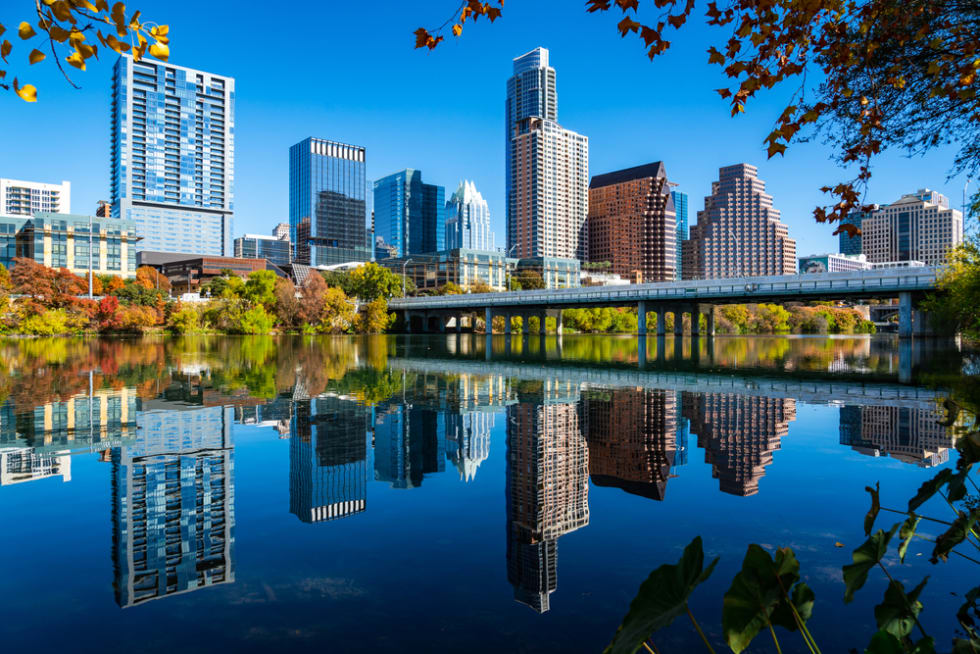 Perfect mirrored reflections over town lake aerial drone views with Perfect Loop Fall Colors and a Growing Austin Texas 