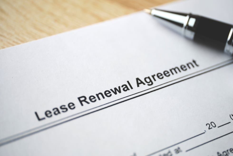  Legal document Lease Renewal Agreement on paper close up.