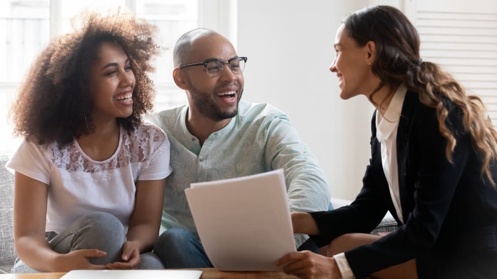 private landlord - young couple visit smiling female consultant talk buying first home together,.jpg