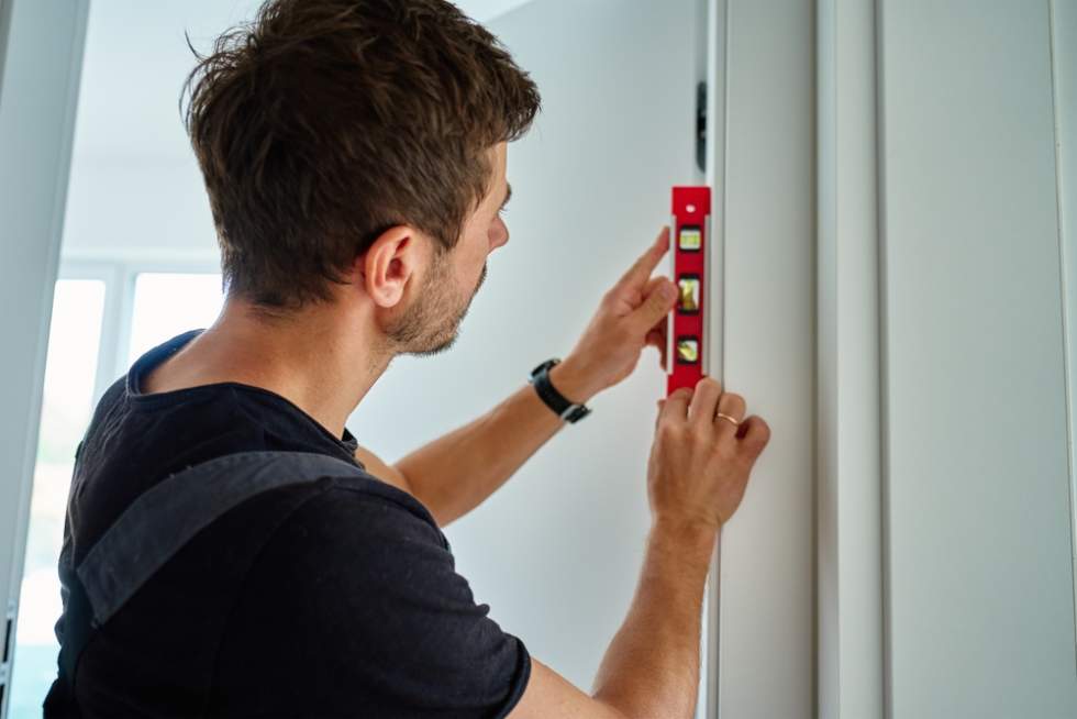 Inspecting the doors on a self-guided apartment tour