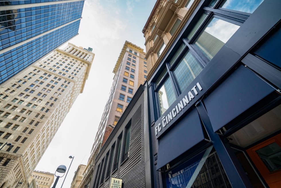 Low angle of exterior of the brand new Official FC Cincinnati Store and surrounding buildings in Downtown Cincinnati.
