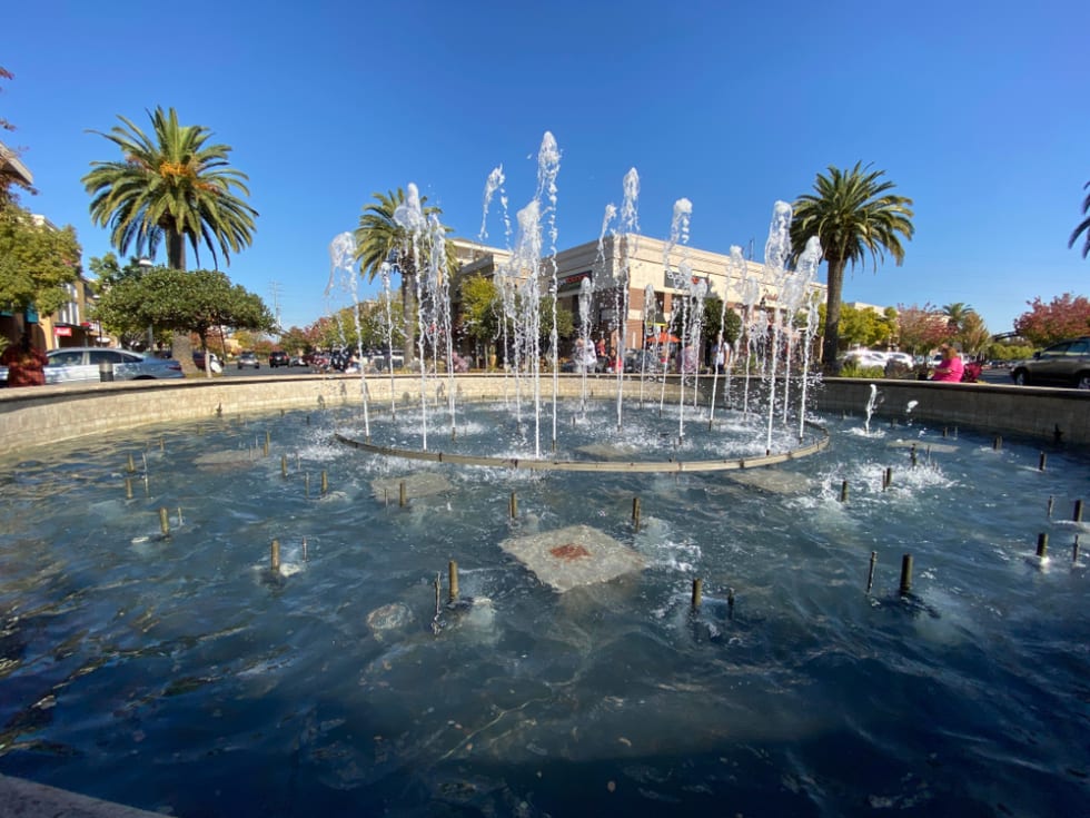 Wide view of the water fountain at The Fountains in the new part of town