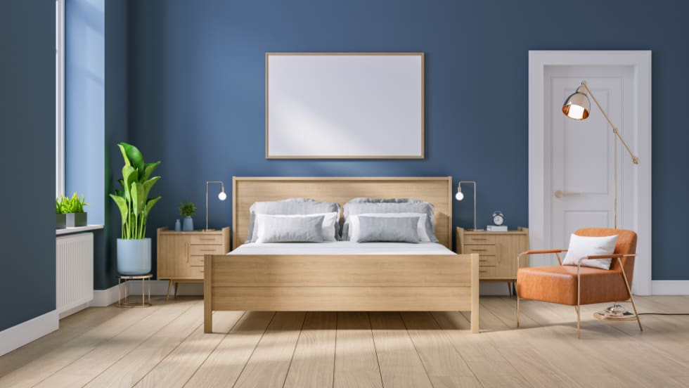 Modern mid century and minimalist interior of Bedroom ,wood bed and bedside table with leather armchair on dark blue wall and wood floor