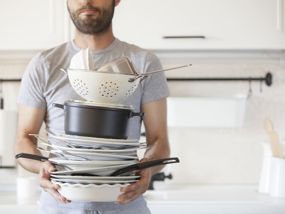 man washing dishes