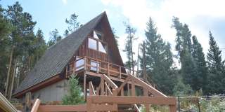 Garden level one bedroom apartment in the hills above BRECK.  Pets OK!  Includes HEAT and electric!  One Car Space in the Garage! Gallery 1