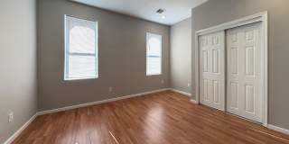 Charming 4BR/2BA Rowhouse with Hardwood-Style Flooring Throughout Gallery 5