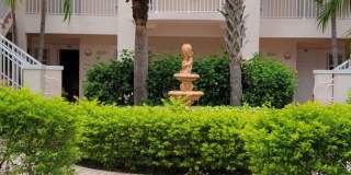 Annual turnkey furnished 2/2 ground floor unit in gated Plaza De Flores in Palmer Ranch. Gallery 1