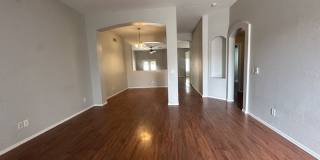 Single-level 3-bedroom home in a desirable Chandler location featuring a 2-car garage and tile roof and wood plank flooring throughout Gallery 6