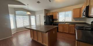 Single-level 3-bedroom home in a desirable Chandler location featuring a 2-car garage and tile roof and wood plank flooring throughout Gallery 14