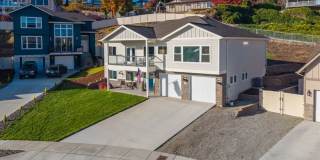 Beautiful 3+ bed, 3 bath home with 4 car garage, VIEWS, chef's kitchen and much more! Gallery 1